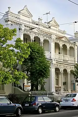 Terrace pair, South Yarra (1890–91) with specially cast "opera-box" balconies.[47]