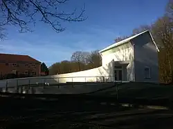 The Maison forestière Wilfred-Owen (2011) by Simon Patterson, dedicated to Wilfred Owen, commissioned by the mayor and inhabitants of the town of Ors (France).