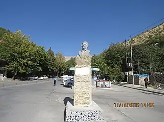 Statue of Kurdish artist Othman Mumin Aziz in the city center of Byara