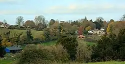 A view of the village of Owslebury, Hampshire, England which sits along the top of a ridge. November 2024.