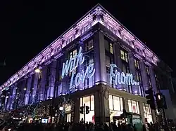 A grand shop covered in Christmas lights