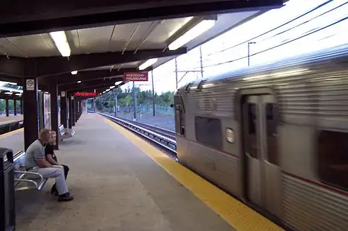 A PATCO Speedline train pulls into the Woodcrest station in Cherry Hill, heading westbound to Philadelphia