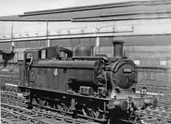 A pannier tank locomotive adapted for underground working. The pannier tank shown is shorter than usual, starting behind the smokebox and after about a third of its length extends down to the footplate. At the front there is a pump and extra pipe work, which also extends above the boiler.
