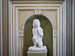 Kneeling child at prayer in the Palazzo Tosio, Brescia