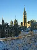 The East Block (left) and West Block (beyond), with its Mackenzie Tower, frame the south facade and Peace Tower of the Centre Block