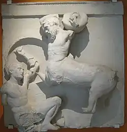 Sculpture of a man fighting a centaur.