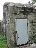 The entrance-door into the pillbox, now having been sealed up and access inside prohibited.