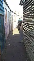 A well-worn path between shacks