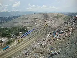 Shanty town beside rubbish dump
