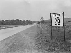 Black-and-white photo of a speed-limit sign