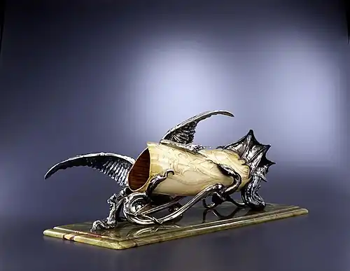 A vase made of silver, onyx and ivory by Philippe Wolfers (1897)