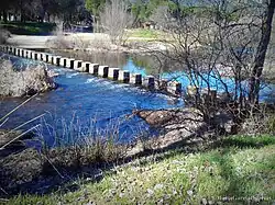 Passing stones on the Guadiana river, in the municipality of Luciana, Ciudad Real, Spain.