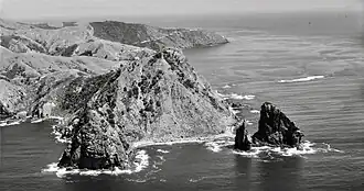 Pinnacle Rock and Cape Colville in 1959
