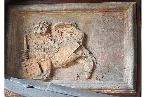 Plaster cast of lion above an inscription. Irakleion, Crete.