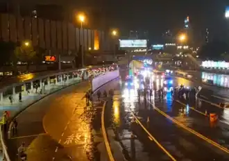 Protesters also staged a flash blockade at the Cross-Harbour Tunnel toll plaza, but the police quickly arrived to clear the scene.