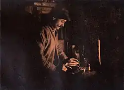 Ponting developing a plate in his Cape Evans dark room