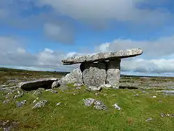 Poulnabrone dolmen, a Neolithic portal tomb about 1 kilometre (0.62&nbsp;mi) north of Caherconnell ringfort.[7]