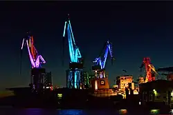 Light design by Dean Skira on cranes in Pula harbour