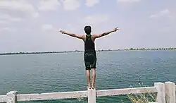 A youth villager enjoys the Kenud pond (Punasa Lift Irrigation Scheme BR-2 Kenud Pond)