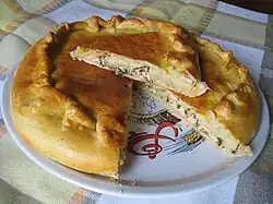 Pirog Pie filled with red beet greens and curd cheese (quark / tvorog)