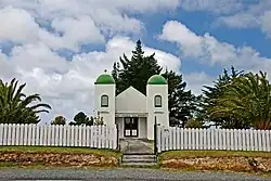 The Rātana Church at Te Kao is characterised by bell towers at each of the front corners, which bear the words "Arepa" and "Omeka" (Māori transliterations of the Greek words Alpha and Omega – the beginning and the end)[1]