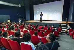 Laza addressing the public at the Rencontres du Film Court Madagascar competition screening, 2016.
