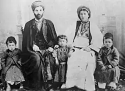 Christian family from Ramallah wearing typical Palestinian Ottoman-period clothing, c. 1905