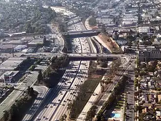 Randy's Donuts can be seen from airplanes landing at LAX (left of the foreground bridge over the freeway at Manchester Boulevard).