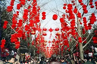 Image 49Red lanterns are hung from the trees during the Chinese New Year celebrations in Ditan Park (Temple of Earth) in Beijing. (from Chinese culture)