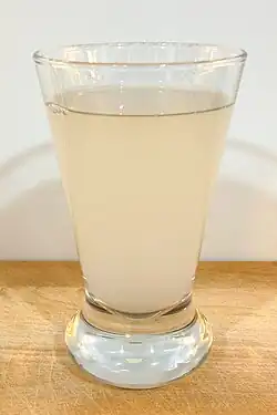 Photo of a glass misty coloured liquid