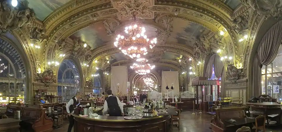 Train Bleu Restaurant in the Gare de Lyon (1902). It looked out from the station facade on one side, and onto the train platform on the other.