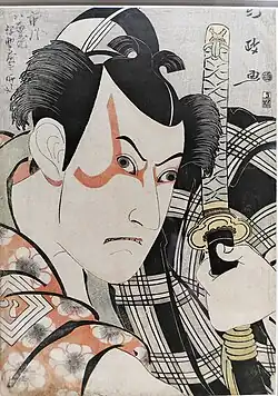 The mon on the right sleeve of the kimono of Kabuki actor Ichikawa Yaozo III, dressed as Umeōmaru. The kanji , meaning 'eight', is written within the triple square. Ukiyo-e (woodblock print) by Utagawa Kunimasa, 1796.