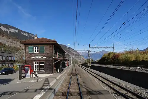 Two-story wooden building with hip roof