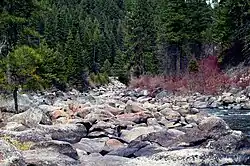 A photo of rocks along a river in Boise National Forest.