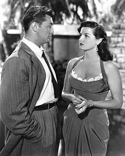 Black and white promotional image of Jane Russell (right) and Robert Mitchum in the 1951 movie His Kind of Woman