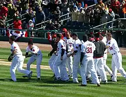 Image 19Baseball games sometimes end in a walk-off home run, with the batting team usually gathering at home plate to celebrate the scoring of the winning run(s). (from Baseball rules)