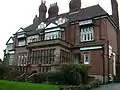 Arts and Crafts, grade II listed building on Hilton Lane, built c1880[33]