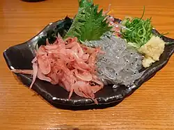 Shrimp and whitebait sashimi with green shiso leaves
