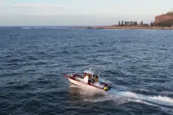 Drone image of a fishing boat off The Point area of Mossel Bay
