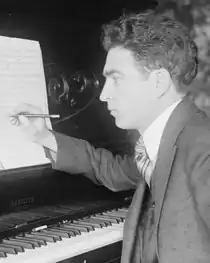 Samuel Gardner composing at a Hamilton piano between 1915 and 1920