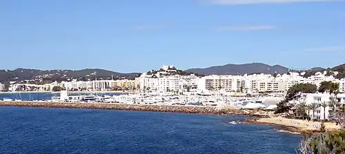 Port and town of Santa Eulària des Riu from NE.