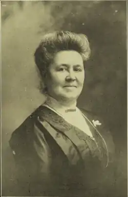 B&W portrait photo of middle-aged white woman.