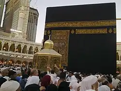Muslim pilgrims surrounding the Maqam (Station) of Ibrahim (Abraham) near the Kaaba in 2008