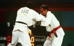 Craig Agena, right, competes against Norway's Alfredo Chinchilla in the 65 kilogram weight class of the judo event at the 1984 Summer Olympics.