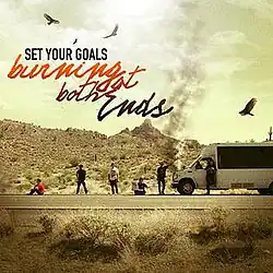 Six guys on the side of the road next to a van with birds circling above them