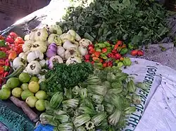 Market stall selling both kutjaa leaves and white wonjo in Newtown, Bakau, Gambia