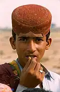 Sindhi boy wearing Sindhi topi (cap) and Sindhi rumal.