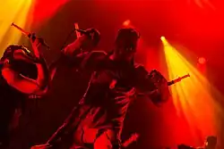 A photo of Nivek Ogre onstage at Wave-Gotik-Treffen during Skinny Puppy's 2017 Down the Sociopath to Euro tour.