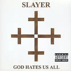 In the center is four Christian crosses in a dark golden color, the bottom of each facing each other, on a white background. Centered above the four crosses is the word "Slayer" also in a dark golden color, with the album name "God Hates Us All" below the crosses.