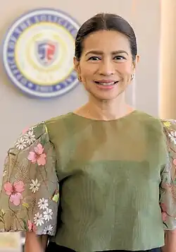 Berberabe wearing a green floral blouse